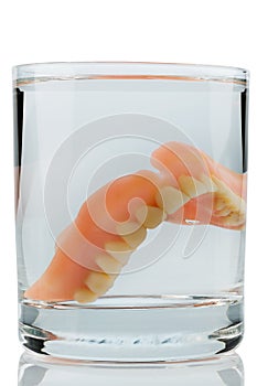 Denture in water glass photo