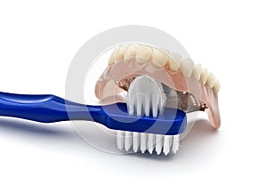 Dentures with brush