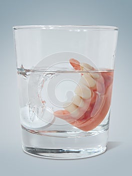 Dentures with cleaning tablet