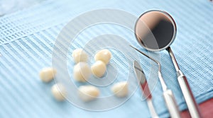 Dentures and dental instrument on table closeup