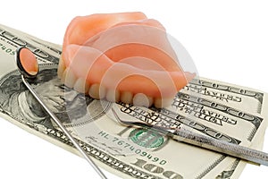 Dentures and dollar bills photo