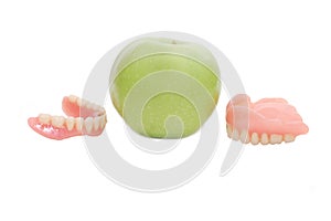 Dentures with green apple