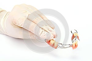 Dentures on a hand