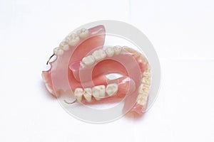 Dentures lie on a white background, upper and lower jaw, top view. Dental prosthetics