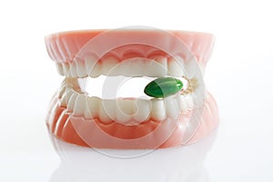 Dentures made of sugar and white chocolate with tablet
