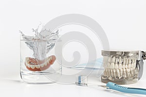 Dentures mold splashing in water