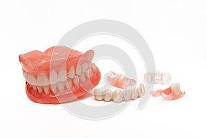 Dentures on a white background. Close-up of dentures. Dentistry is conceptual photography. Prosthetic dentistry. False teeth.