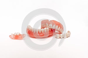 Dentures on a white background. Close-up of dentures. Full removable plastic denture of the jaws. Prosthetic dentistry.