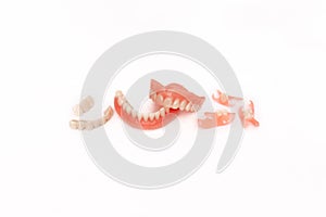 Dentures on a white background. Close-up of dentures. Full removable plastic denture of the jaws. Prosthetic dentistry.