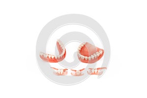 Dentures on a white background. Close-up of dentures. Full removable plastic denture of the jaws. Prosthetic dentistry.