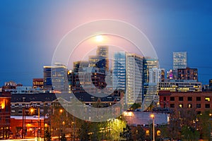 Denver Colorado colorful night skyline with glowing full moon