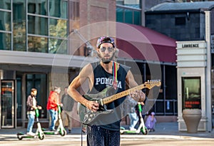 A street musician performing on Sixteenth street in downtown Denver, Colorado, on Hallowing d