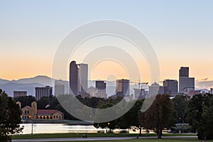 Denver downtown skyline and rocky mountain at sunset.