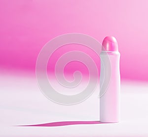 Deodorant on pink-white background