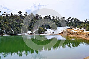 Deoria or Deoriya Tal Lake, Lush Green Forest, Snow, and Sky - Beautiful Himalayan Landscape - Uttarakhand, India