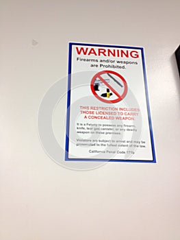 Department of motor vehicles DMV indoor office no firearms warning sign