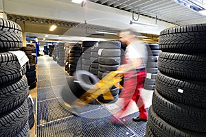 Department store with car tyres in a garage - tyre change