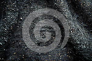 Depicting a black felt fabric texture background, closeup of dark gray wool surface with fine threads, seamless pattern for t