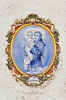 Depiction of Saint Antony of Lisbon holding infant jesus.