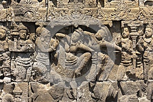 Depictions of mythological scenes from the life of Buddha, Borobudur temple, Indonesia photo