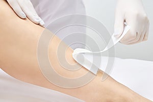 Depilation legs. Cosmetic procedure. Beauty and health. Bright skin