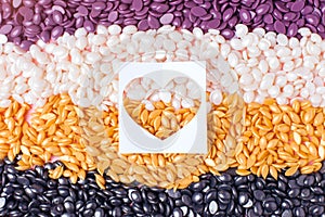 Depilatory colorful Pearl Hard Wax Beans and heart, concept of skincare bodycare, beauty industry, spa salon, hait remove