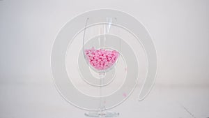 The depilatory wax in the glass on white background