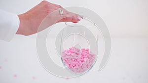 The depilatory wax in the glass on white background