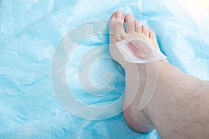 Depilatory wax strip for hair removal on human leg in beauty salon. Copy space for text, smoothness