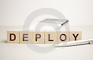 DEPLOY word made with building blocks. Concept