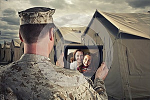 Deployed Military Man Chats with Family