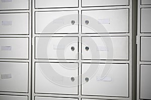 Deposit boxes at the post office for incoming mail.