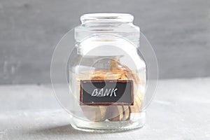 Deposit or Saving money, dividends concept. Money jar and text.