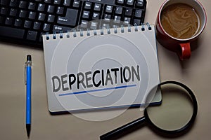 Depreciation write on a book isolated on office desk