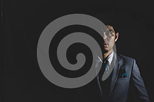 Depress business mature man stand in the dark