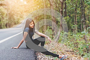 Depress and hopeless , Asian woman sitting on roadside