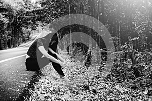 Depress and hopeless , Asian woman sitting on roadside