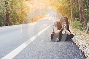 Depress and hopeless , Asian woman sitting on roadside