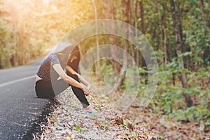 Depress and hopeless , Asian woman sitting on roadside