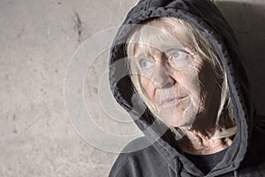 Depress senior person with concrete background