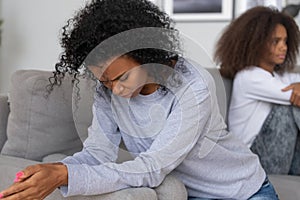 Depressed black mom and daughter avoid talking after fight photo