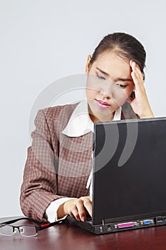 A depressed Asian businesswoman