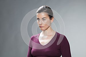 Depressed beautiful 30s woman expressing distraught and emptiness photo