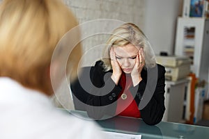 Depressed blonde employee dismissed in office