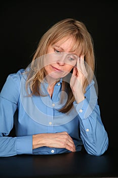 Depressed blonde older woman