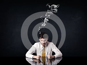 Depressed businessman with smoking head