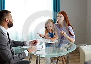 Depressed caucasian woman with child girl get support by psychologist