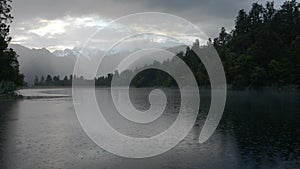 Depressed cloudscape and strong rain over the Lake Matheson