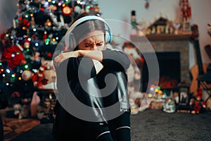 Depressed Crying Woman Listening to Christmas Carols alone