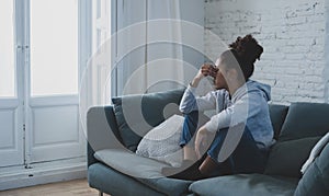 Depressed and distressed african american woman feeling lonely, sad and exhausted